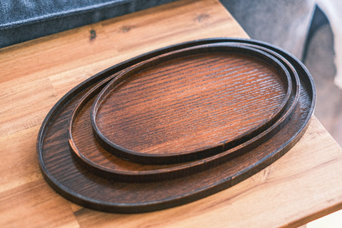 Oval natural timber plates.