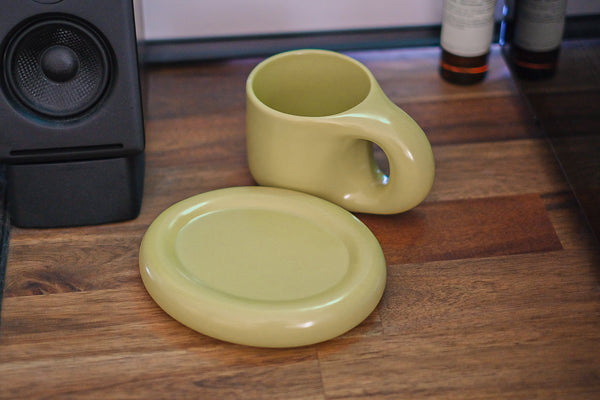 A chunky boy in matcha with coaster