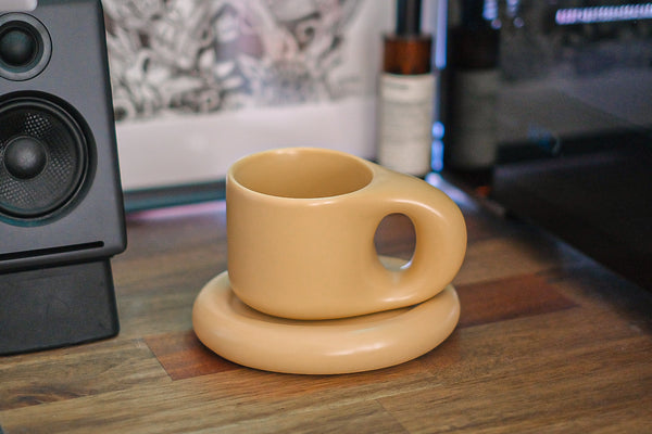 A chunky boy in milk tea with coaster