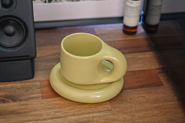 A chunky boy in matcha with coaster